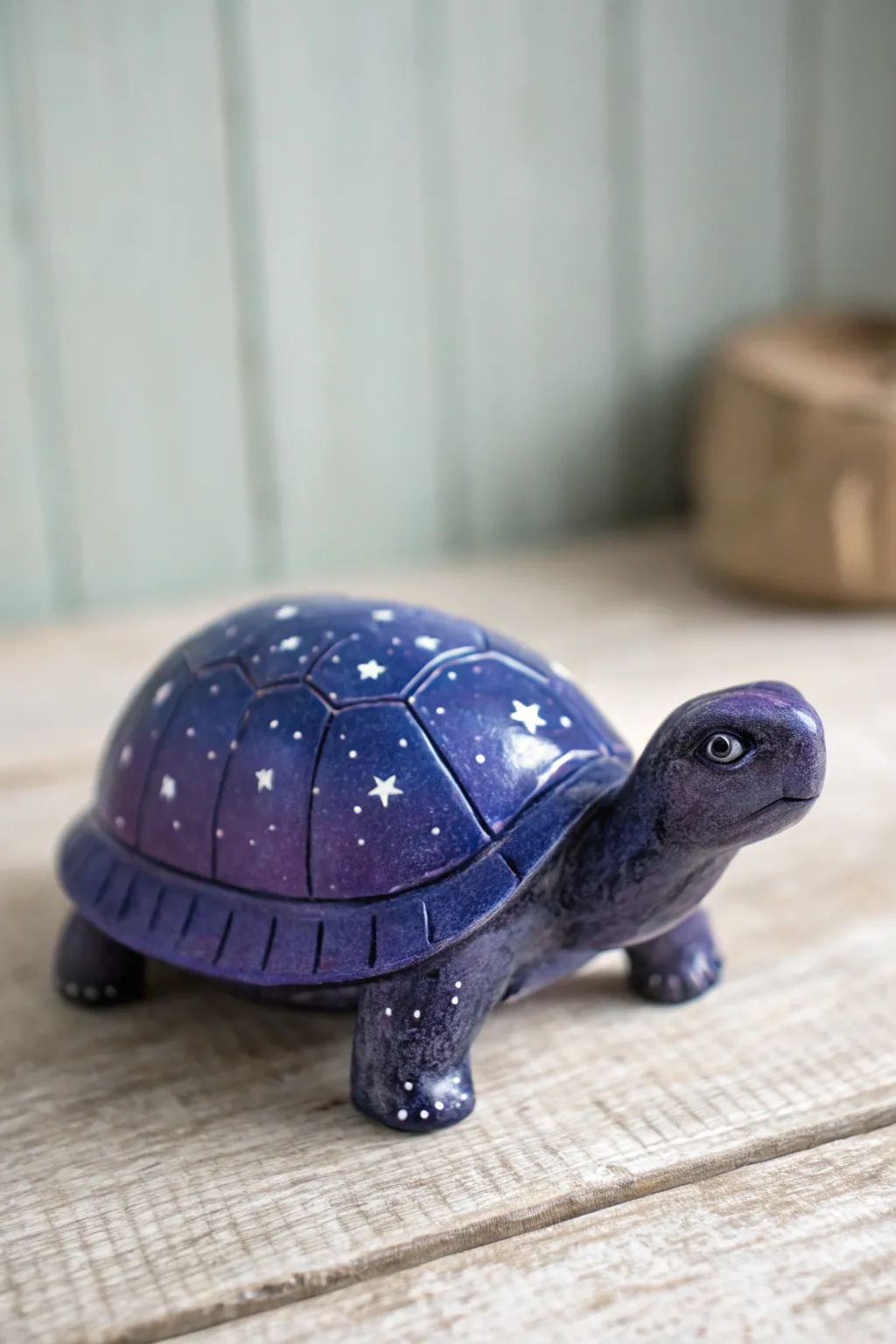 Galaxy turtle with dreamy star speckles and a navy-to-violet shell in moody, minimalist light