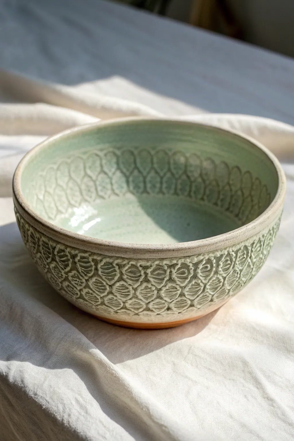 Minimal textured rolling pin bowl in soft sage glaze, a simple ceramics project idea.