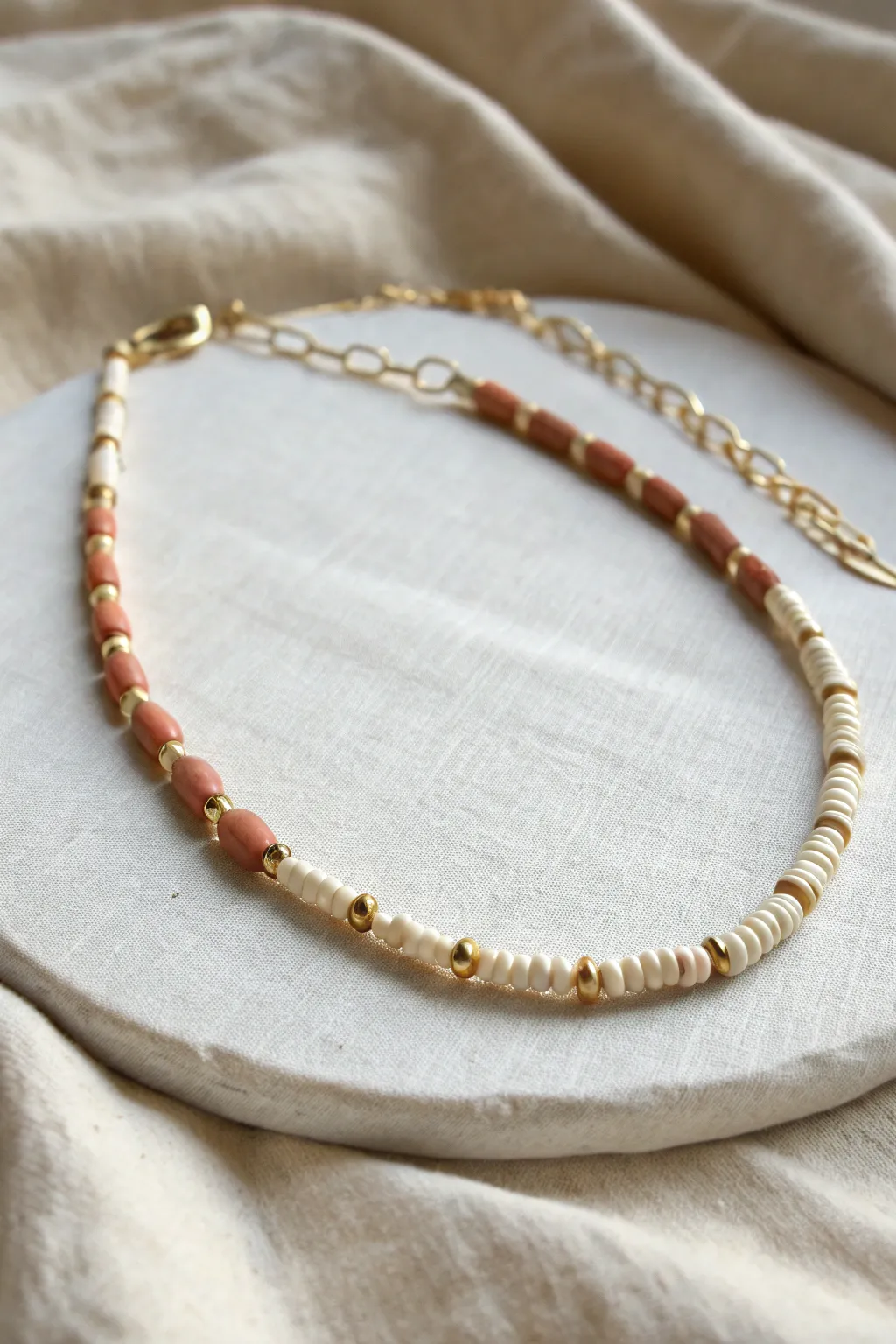 Minimal paperclip-link clay bead choker with a short bead segment and visible clasp details