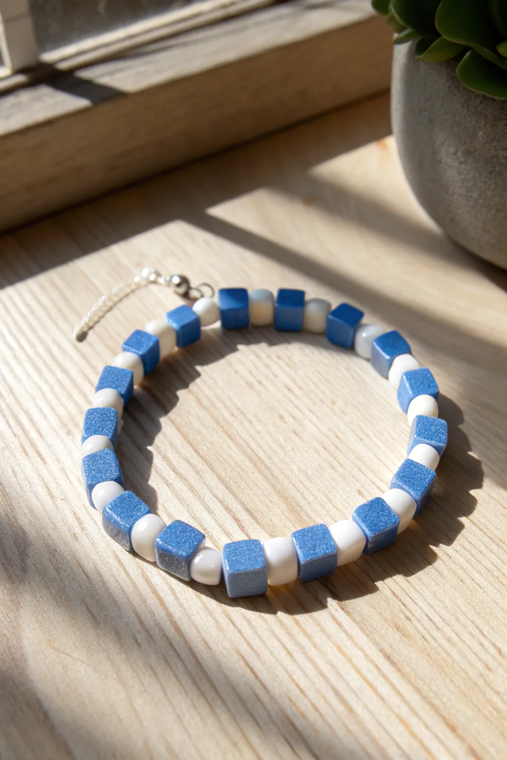 Blue and white checkerboard clay bead bracelet for clean, bold contrast and cozy boho vibes.