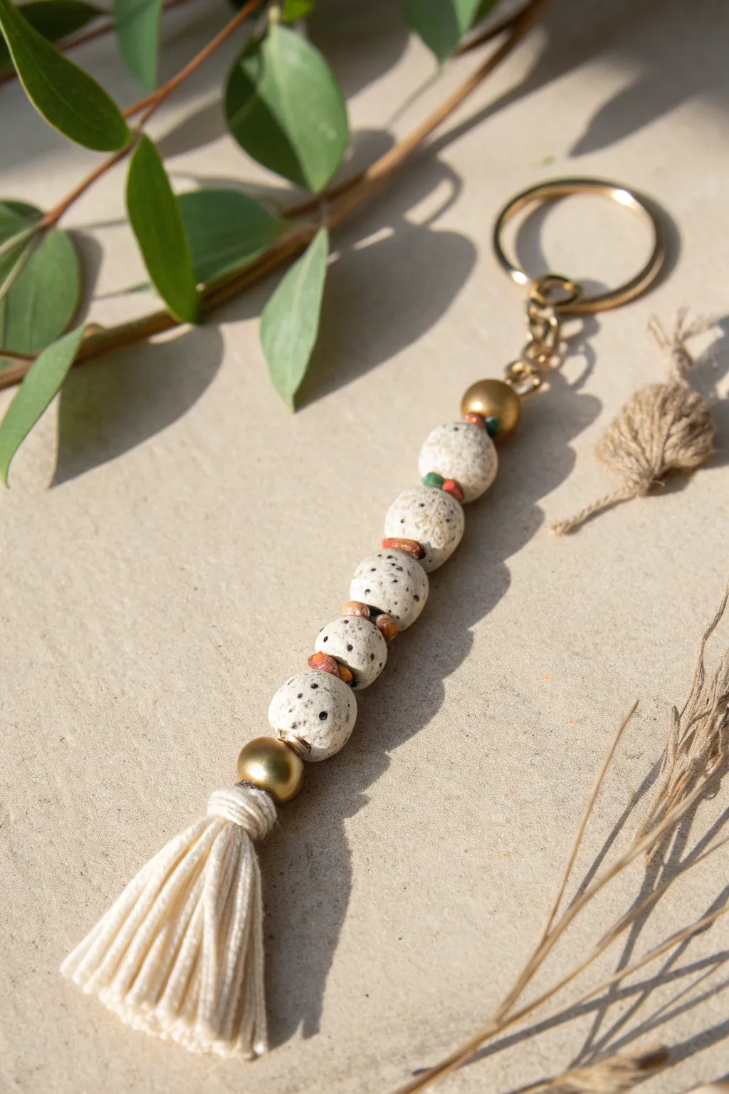 Terrazzo-speckled heishi bead keychain with soft neutrals, minimal lines, and handmade charm