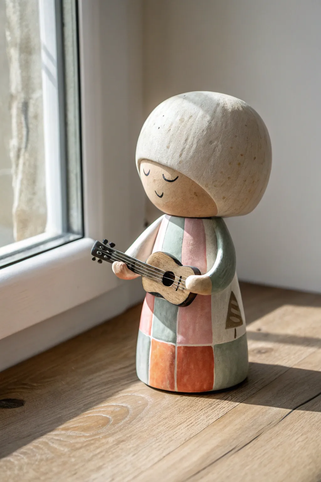 Minimal clay musician bobblehead with tiny guitar, bold color blocks, calm Nordic vibe.