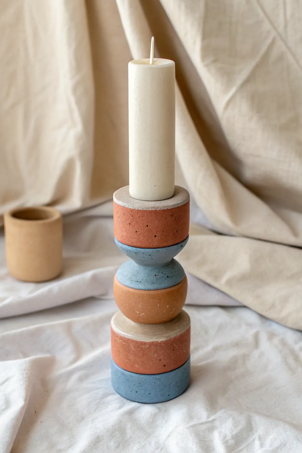Minimal color-block candle holder in cream, terracotta, and muted blue for easy clay craft inspo