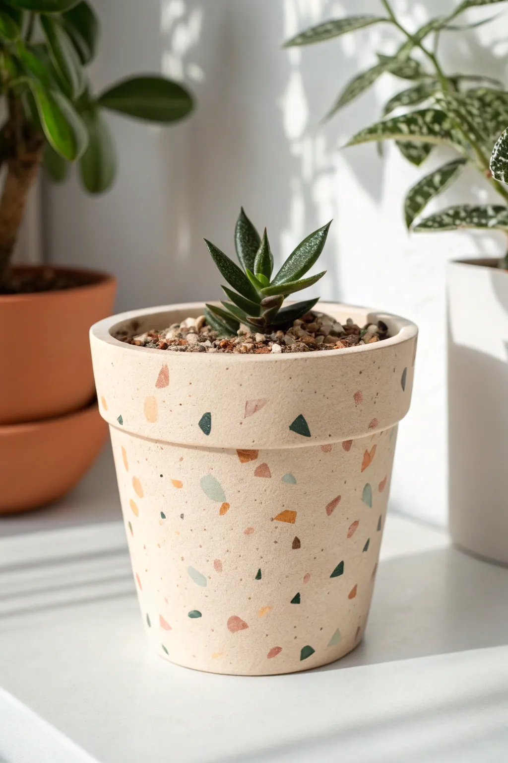 Terrazzo-style speckles on a neutral painted pot for an easy, modern handmade look