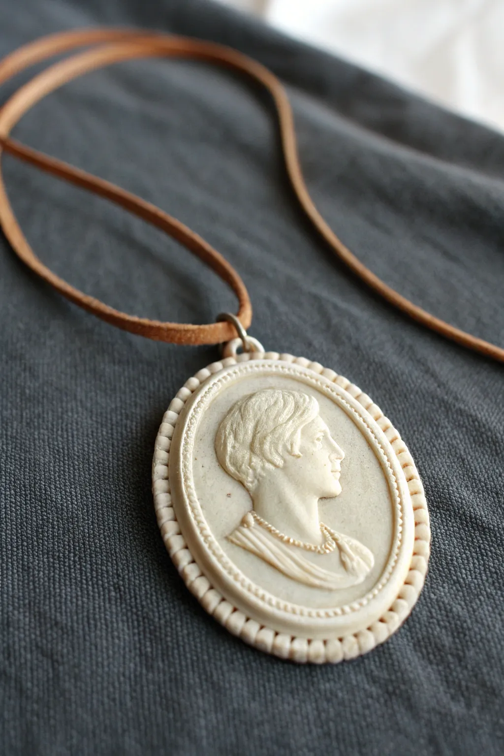 Framed cameo clay medallion pendant, matte vintage finish, minimalist Scandinavian with a boho touch