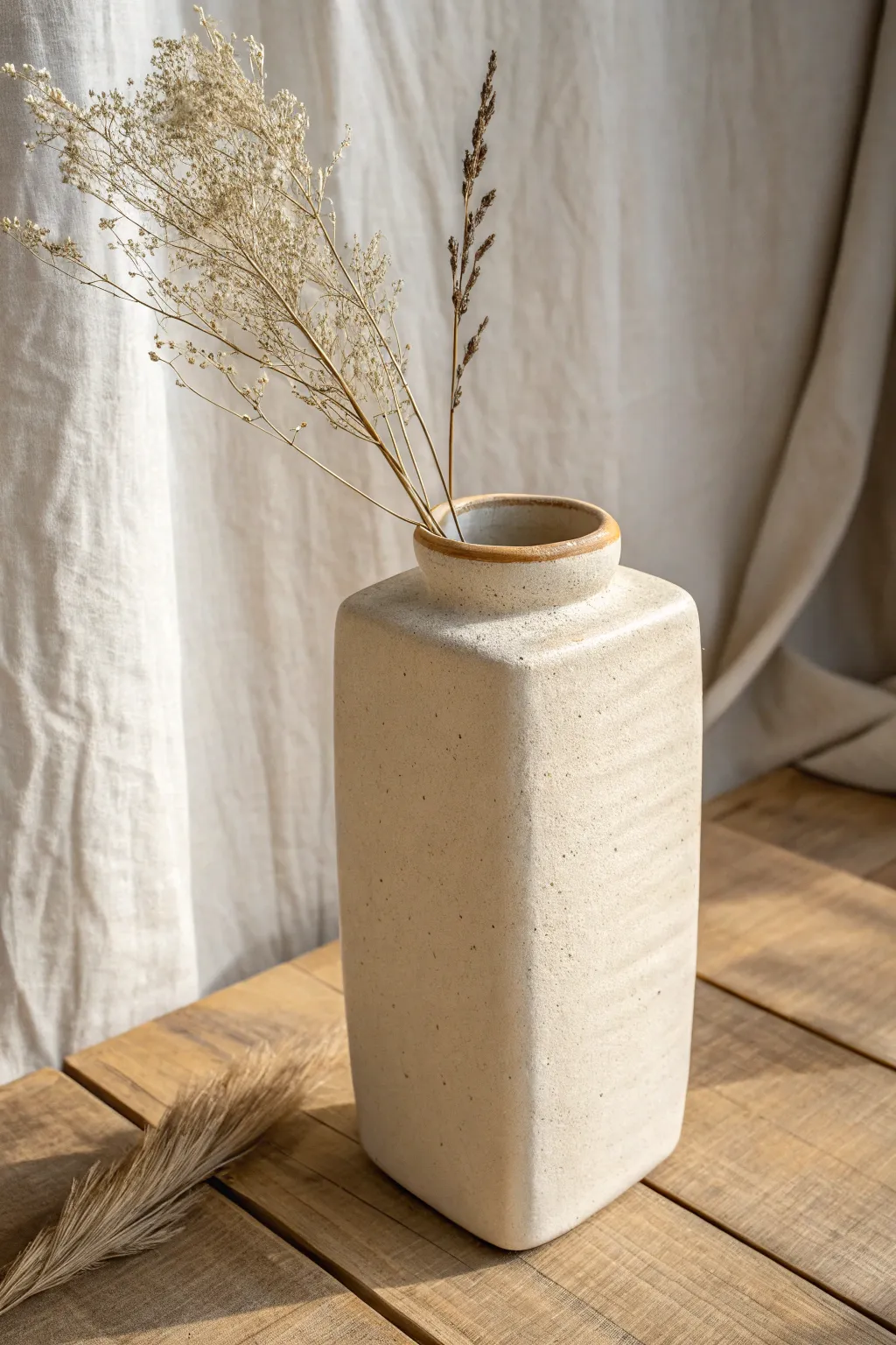 Minimal slab vase with an exposed seam, turning a simple join into a modern handmade detail.