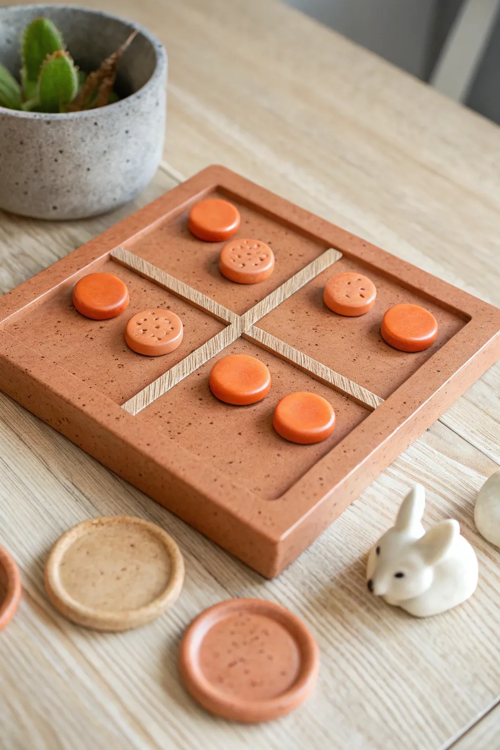 Cozy woodland tic tac toe: terracotta board with simple orange foxes and cream rabbits