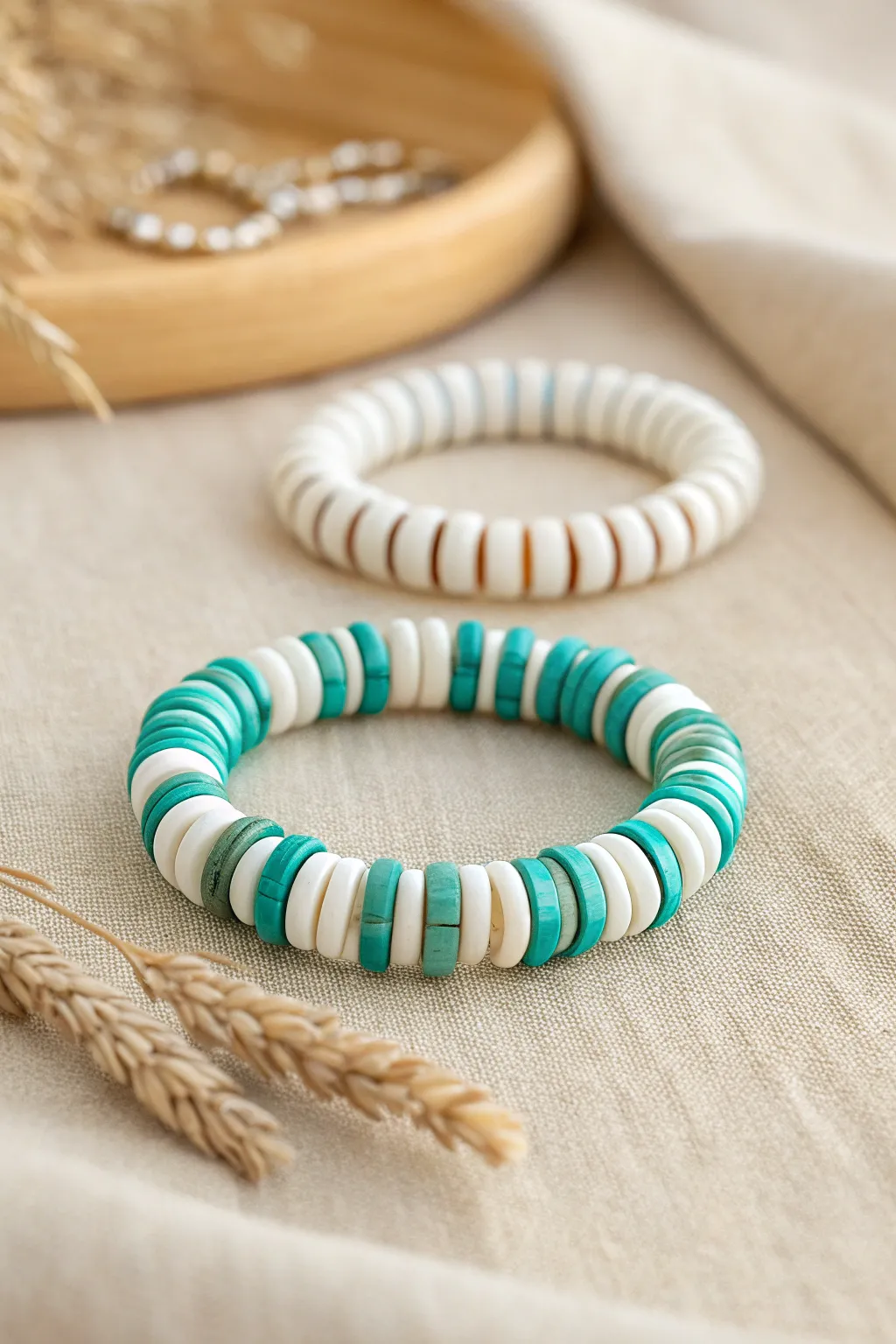 Candy stripe clay disc beads in white and teal, a minimal boho bracelet stack with crisp contrast