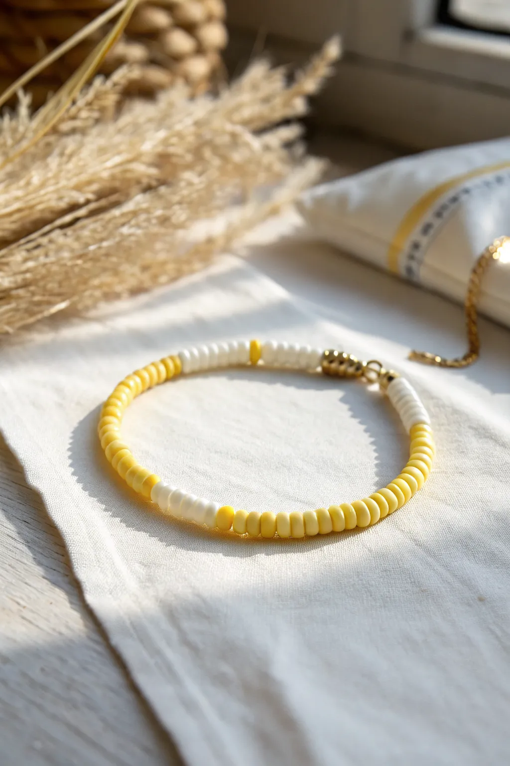 Lemonade-inspired heishi bracelet in sunny yellow and white for an easy, cute summer look.