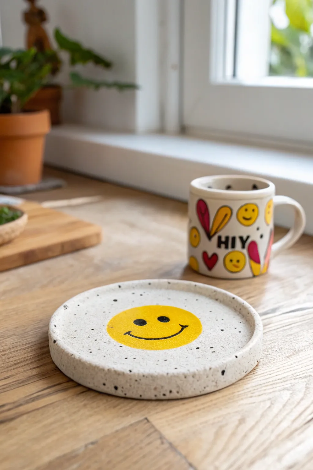 Cheerful smiley clay coaster in sunny yellow, a simple handmade accent for your coffee break