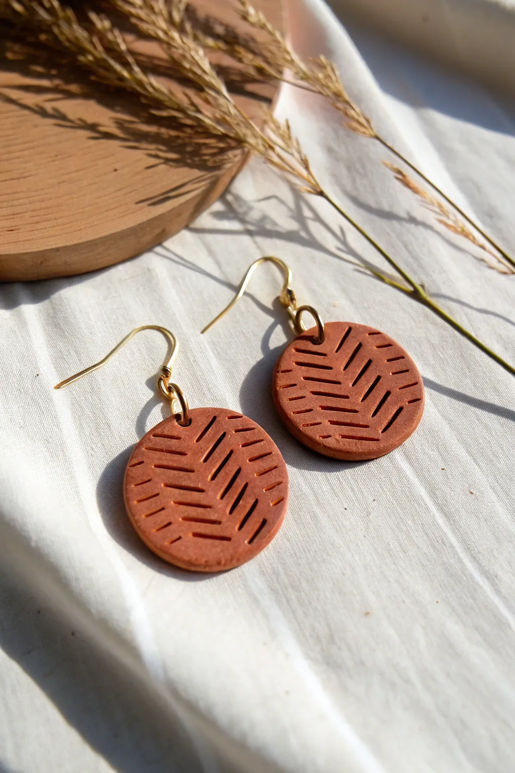 Minimal stamped clay earrings in earthy tones, simple texture for an easy DIY statement.