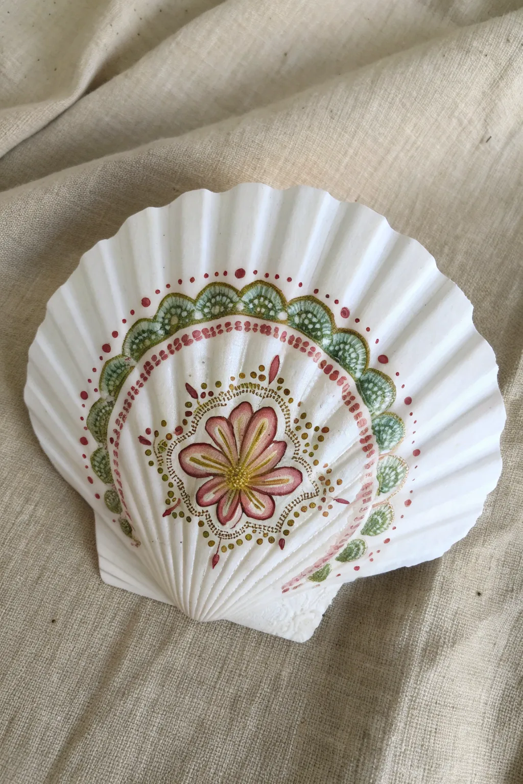 Find your zen with this symmetrical mandala dot shell art. A perfect relaxing DIY project.