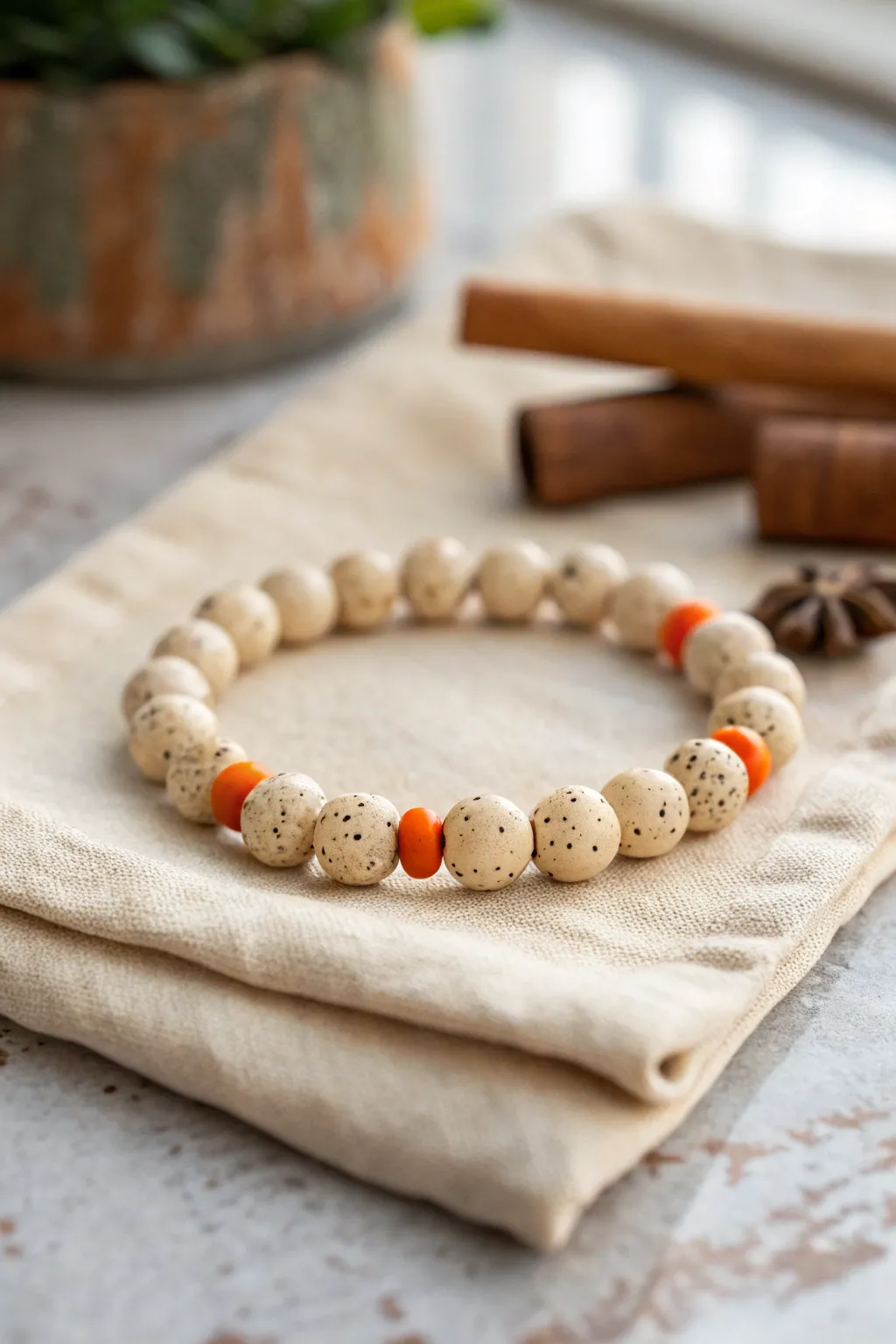 Pumpkin bread vibes in bead form: creamy speckle clay beads with cozy orange accents.