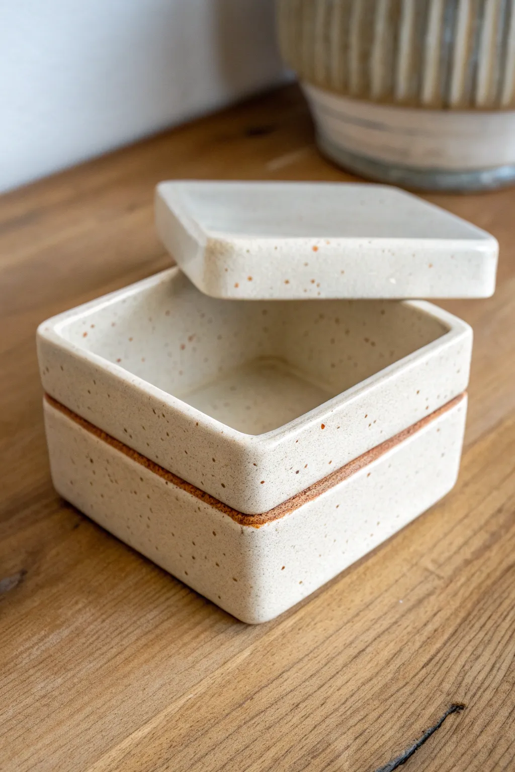 Minimal slab box with a fitted lid ajar, perfect for trinkets and keepsakes in calm neutral tones.