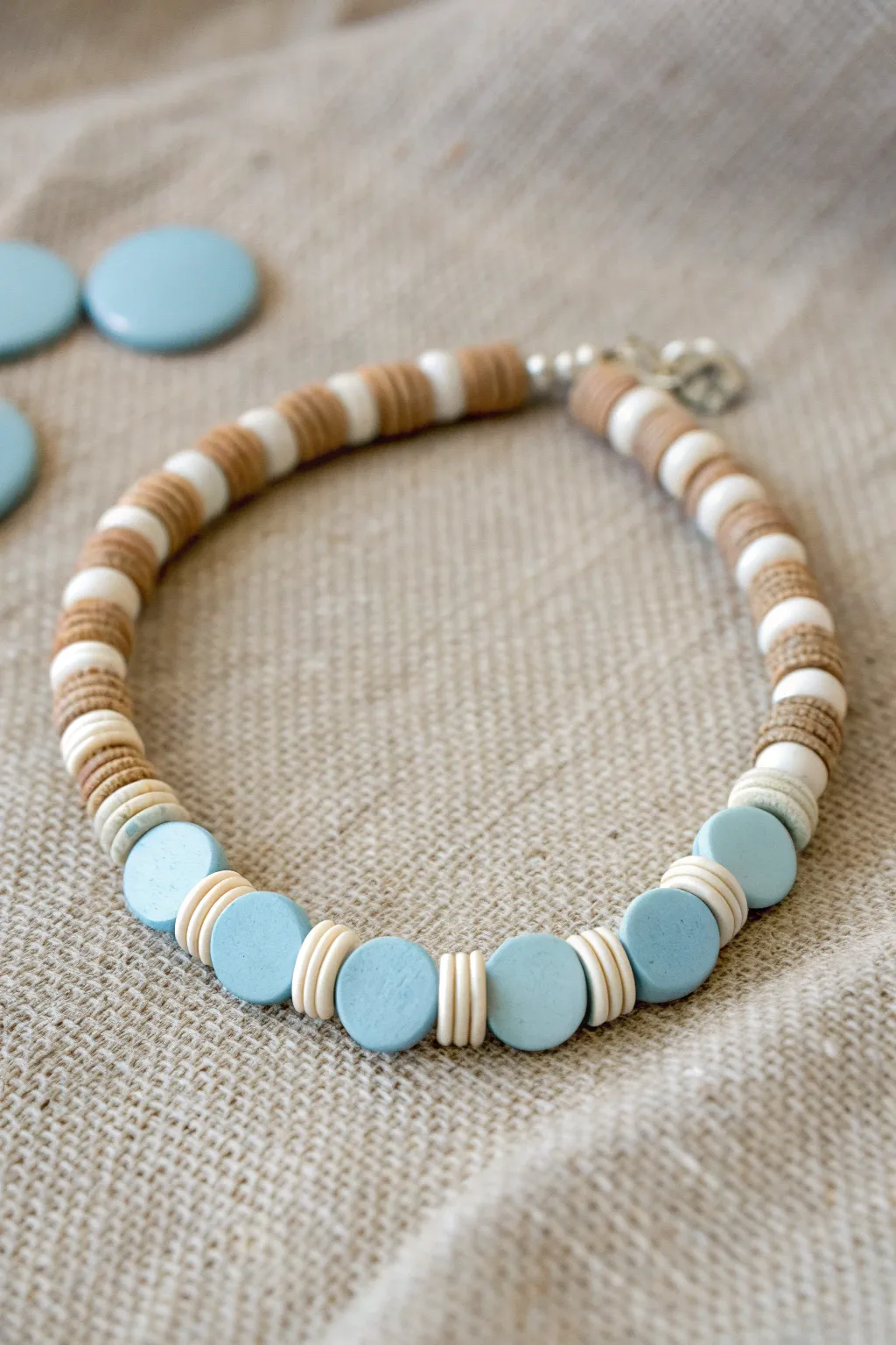 Mini stripe repeat clay disc bracelet in white and dusty blue, clean, playful, and handmade