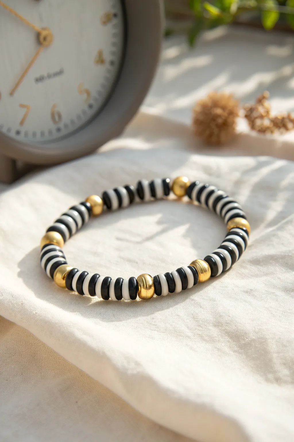 Bold black and white clay beads with gold spacers, a chic countdown bracelet for New Year