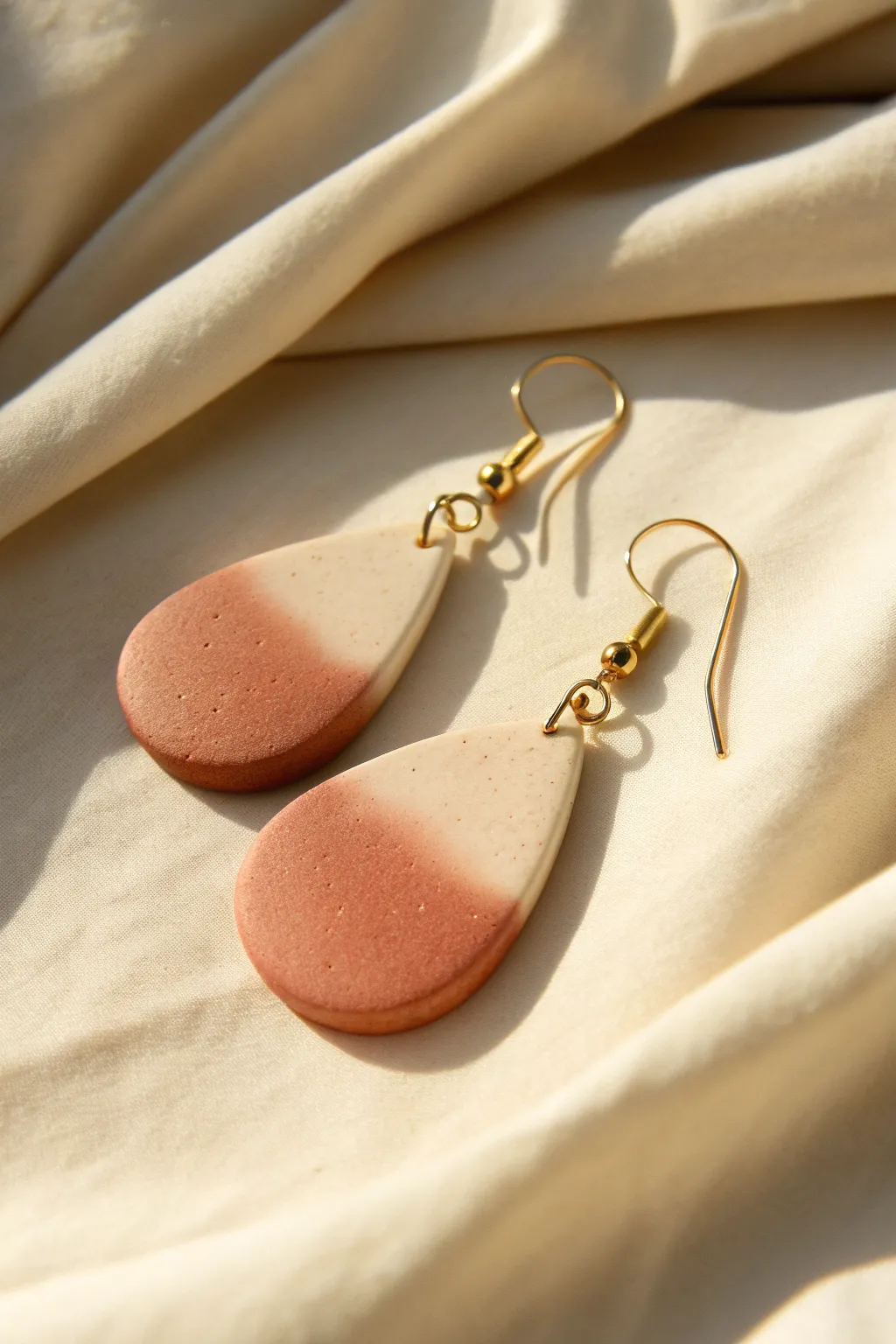 Soft ombre teardrop dangles in oven bake clay, minimal and elegant with warm shadows.