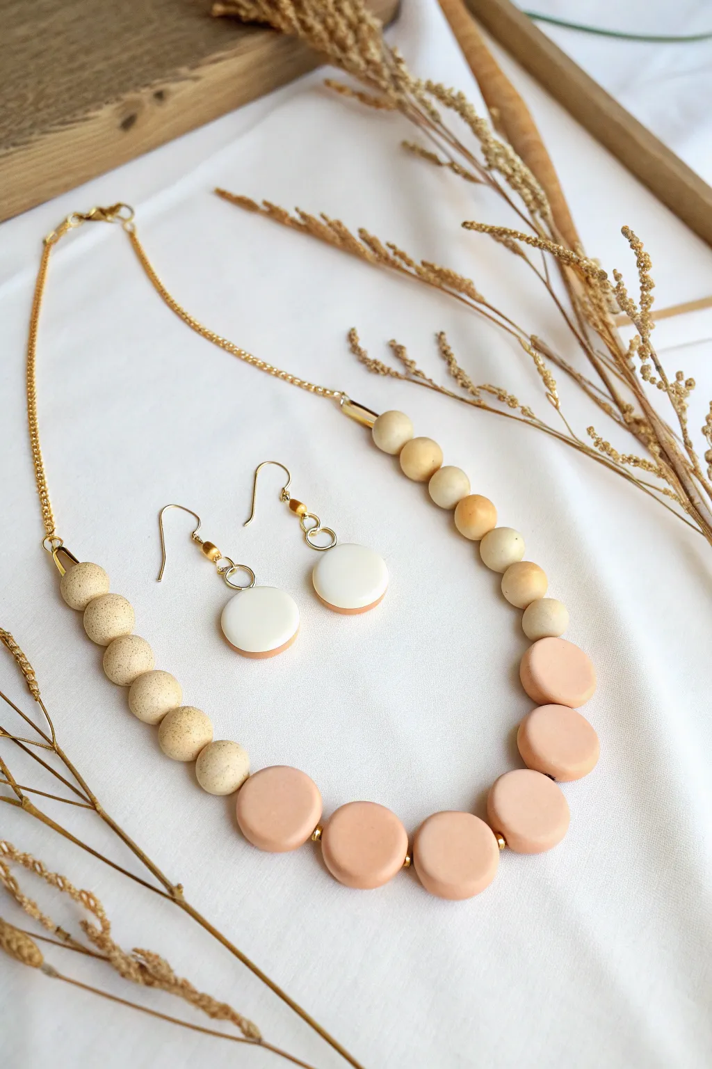 Minimalist lentil bead polymer clay necklace set with matching studs in warm neutrals