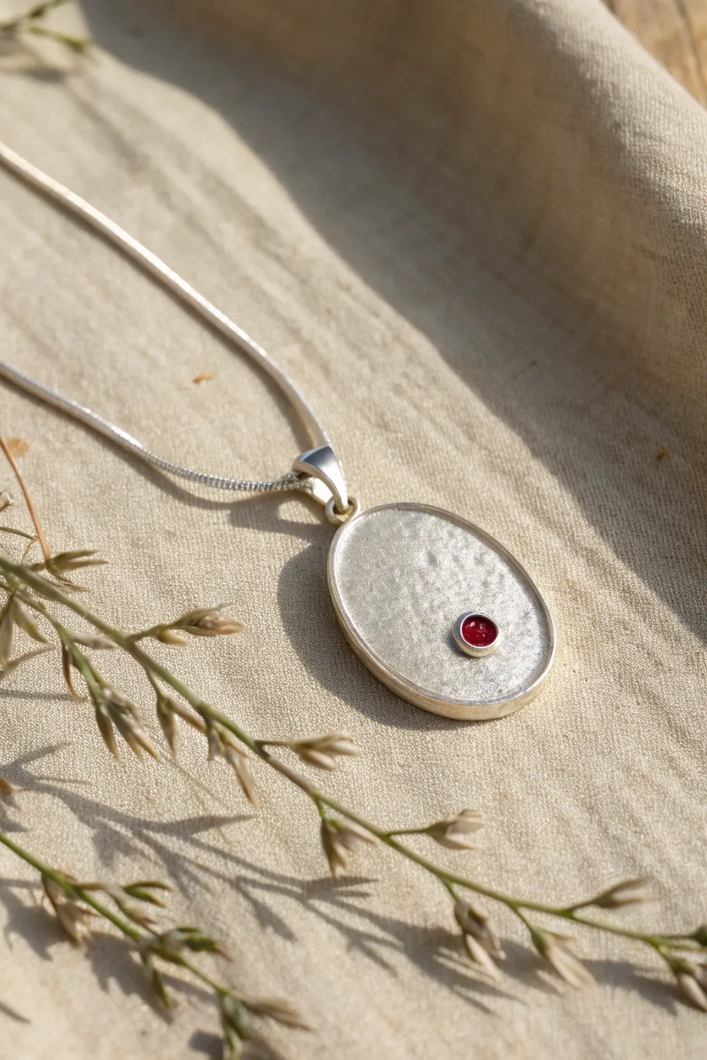 Simple silver clay pendant with a bezel-set stone accent for an elegant minimalist look