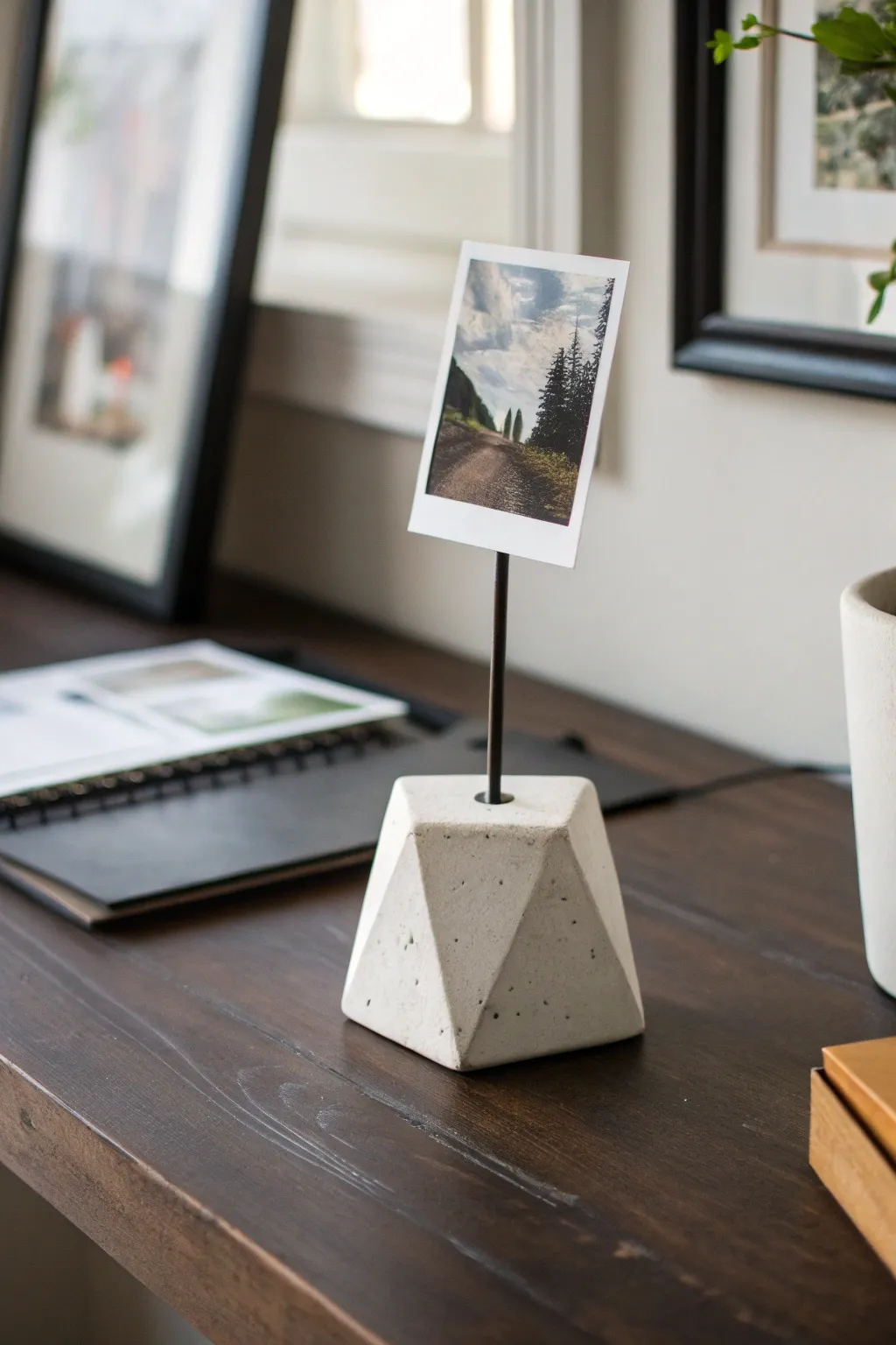 Mini clay photo holder with a tiny art print, Scandinavian minimal style with soft boho warmth.