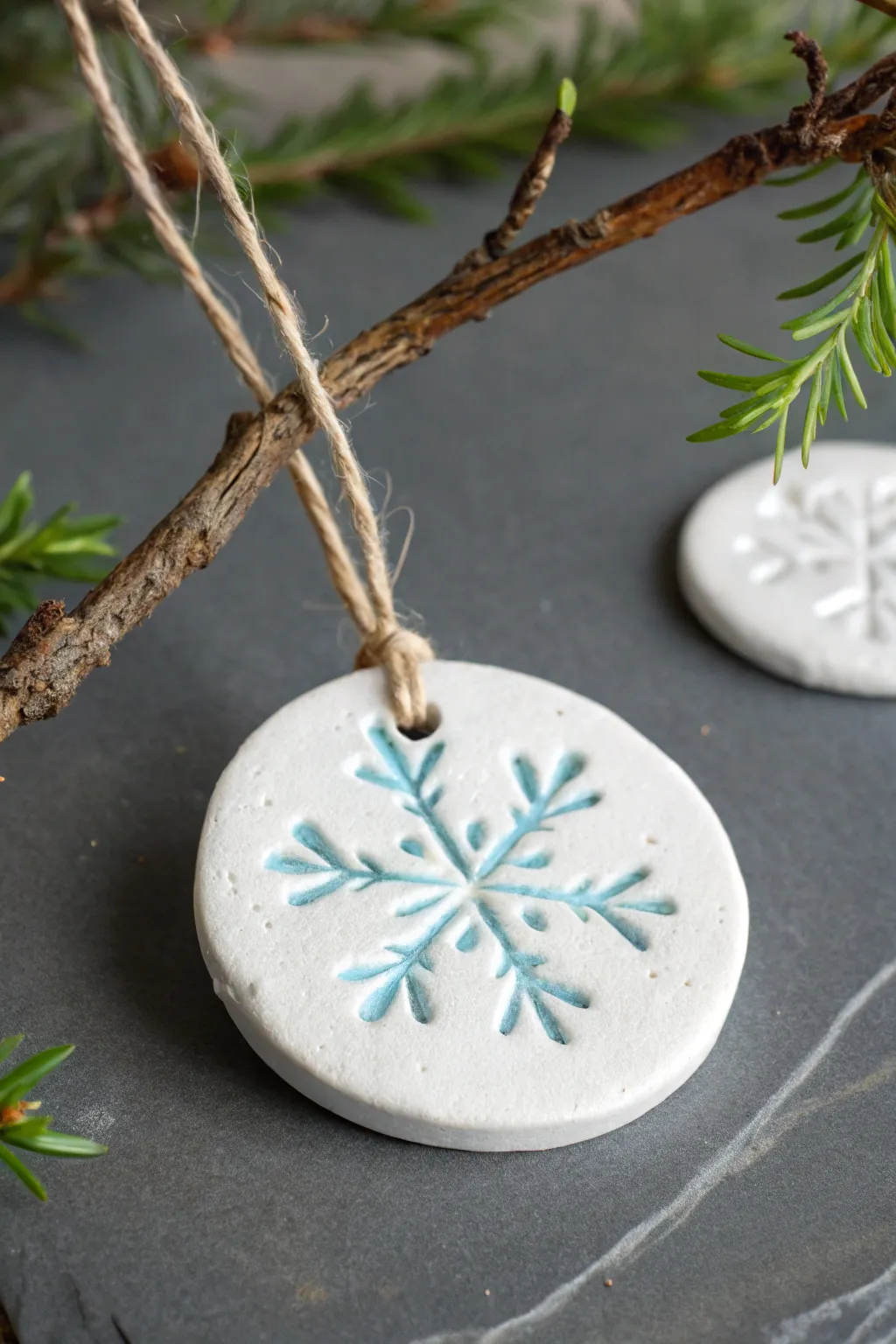 Minimal snowflake-stamped air clay ornaments with icy accents for a clean, cozy winter look