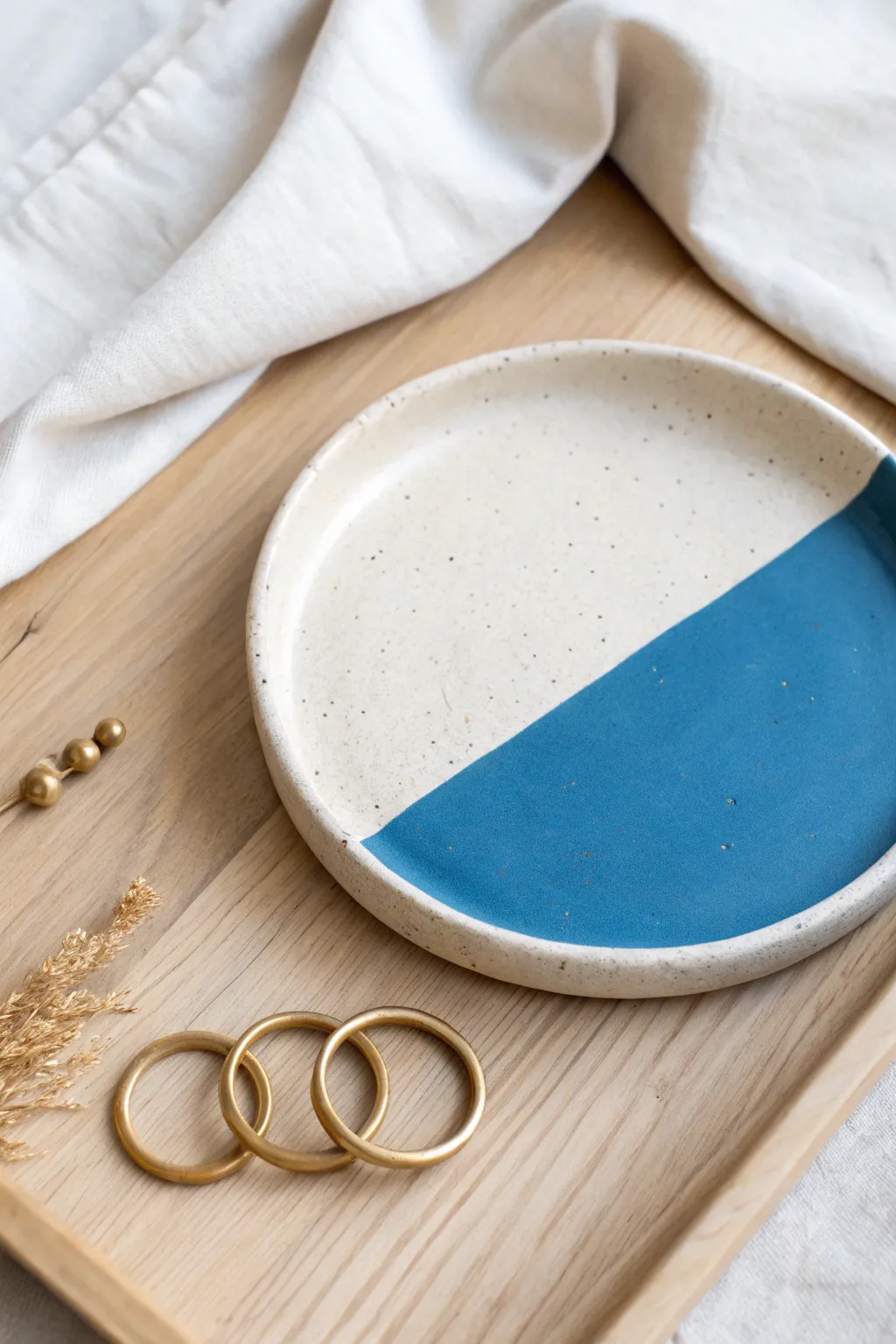 Half dipped color block air dry clay plate with bold contrast and minimal Scandinavian styling