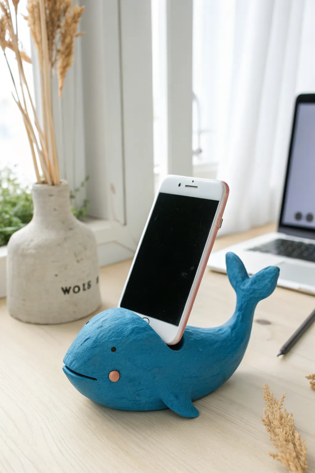 Bold cobalt whale phone stand in air-dry clay, a simple DIY sculpture idea with playful charm