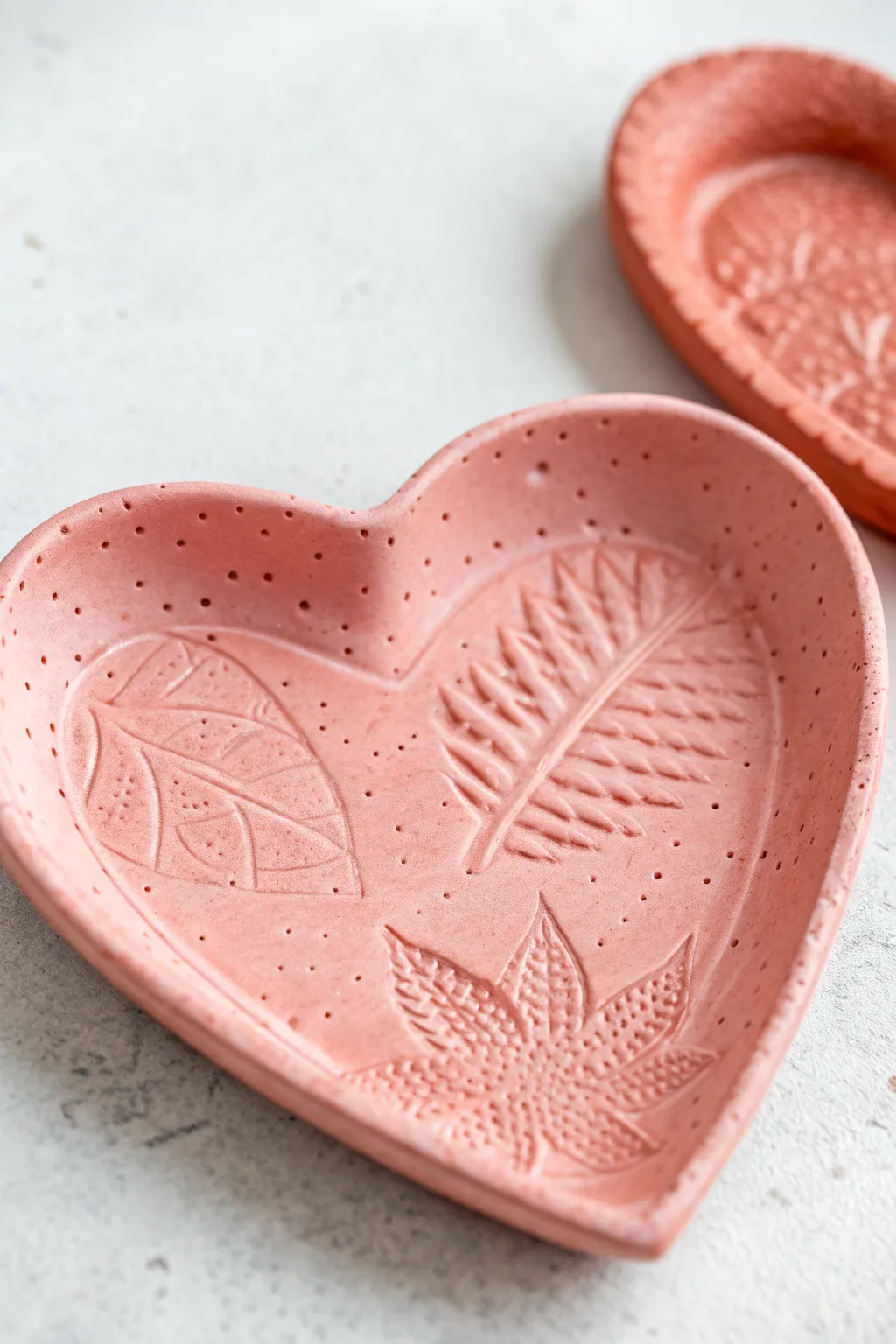 Bright heart trinket tray with playful stamped texture, a sweet air dry clay craft for kids.