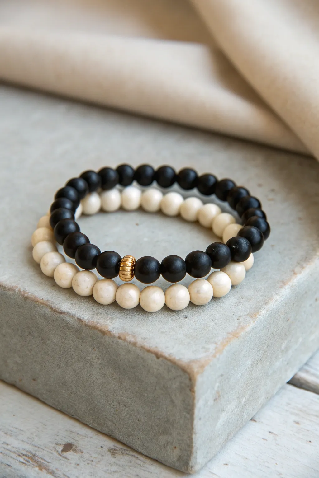 Checkerboard clay bead bracelet stack with bold black-white and black-cream alternation