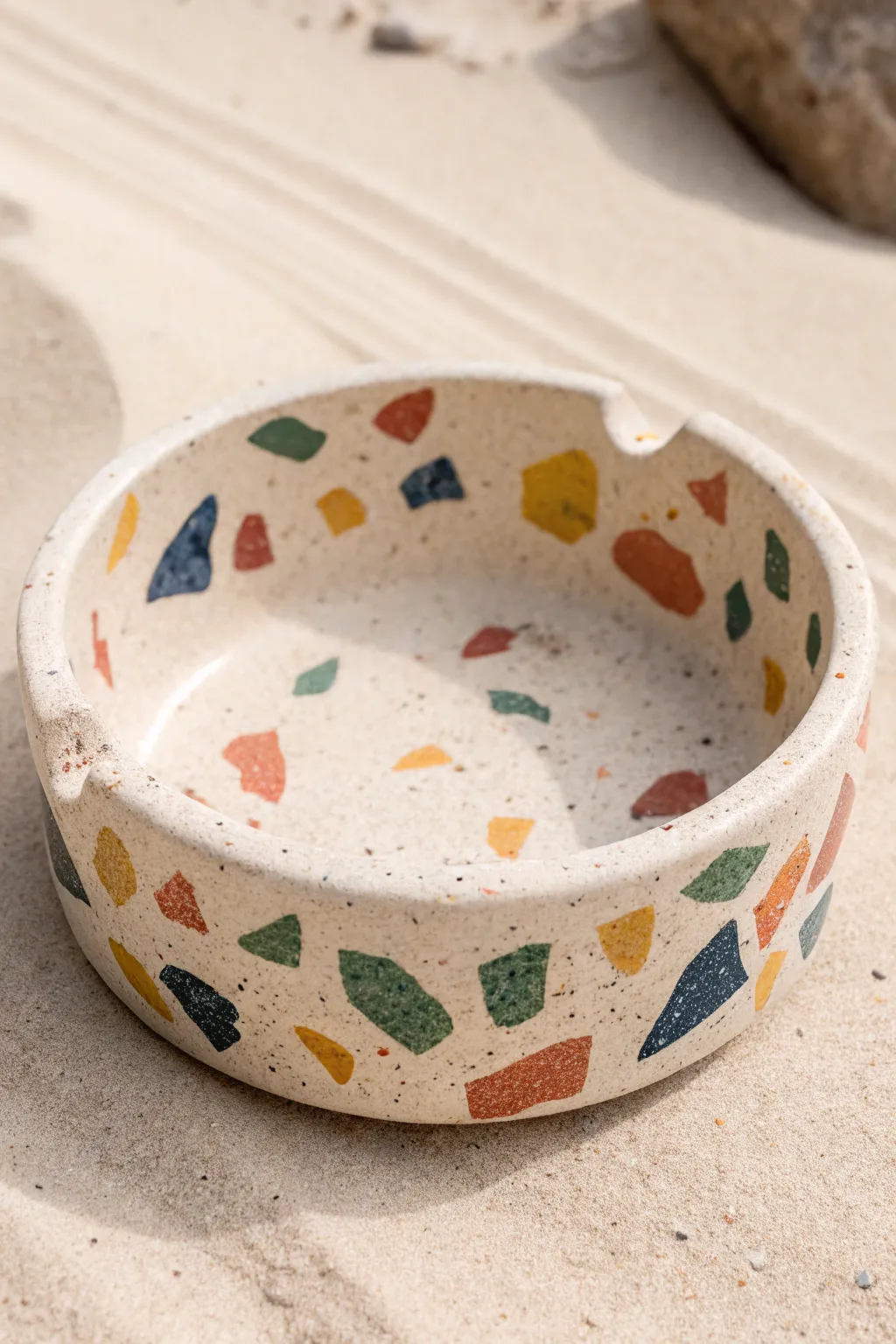 Terrazzo-style slip-speckled ceramic ashtray with bold chips and clean notch rests
