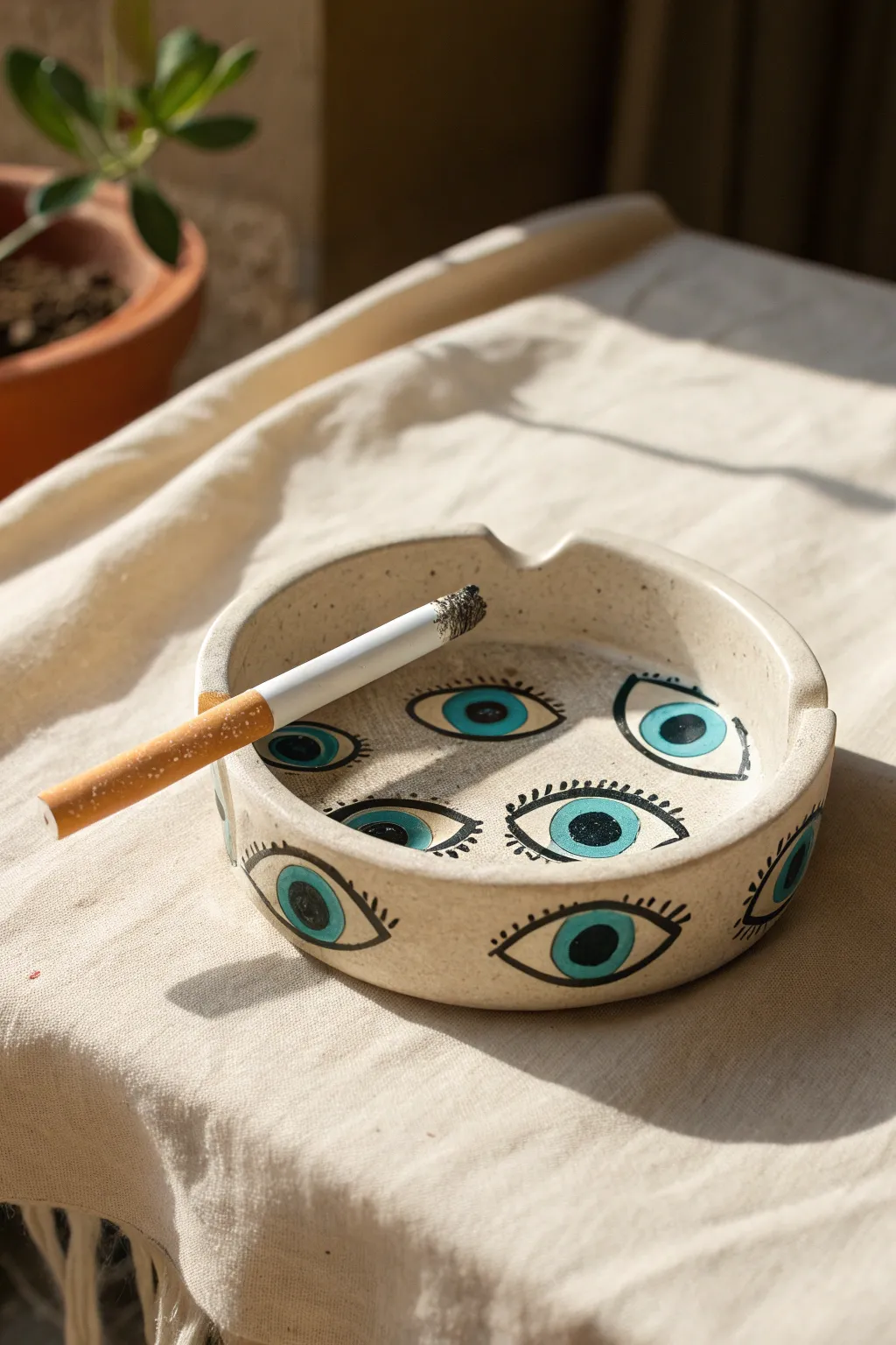 Surreal eyeball cluster clay ashtray with glossy glaze and bold irises, minimal yet striking