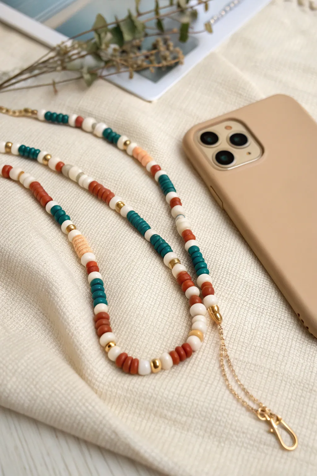 Soft checkerboard heishi phone charm in bold, calming colors for a minimalist boho aesthetic.