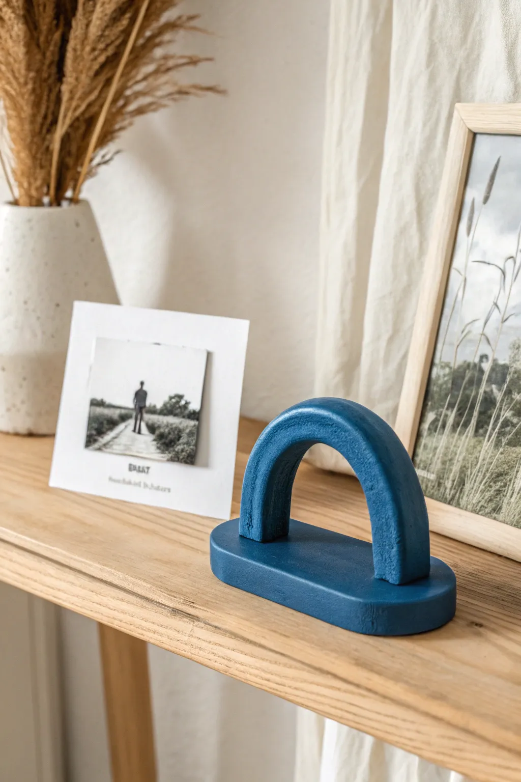 Minimal clay photo and place card stand with monochrome print in bold Scandi-boho styling