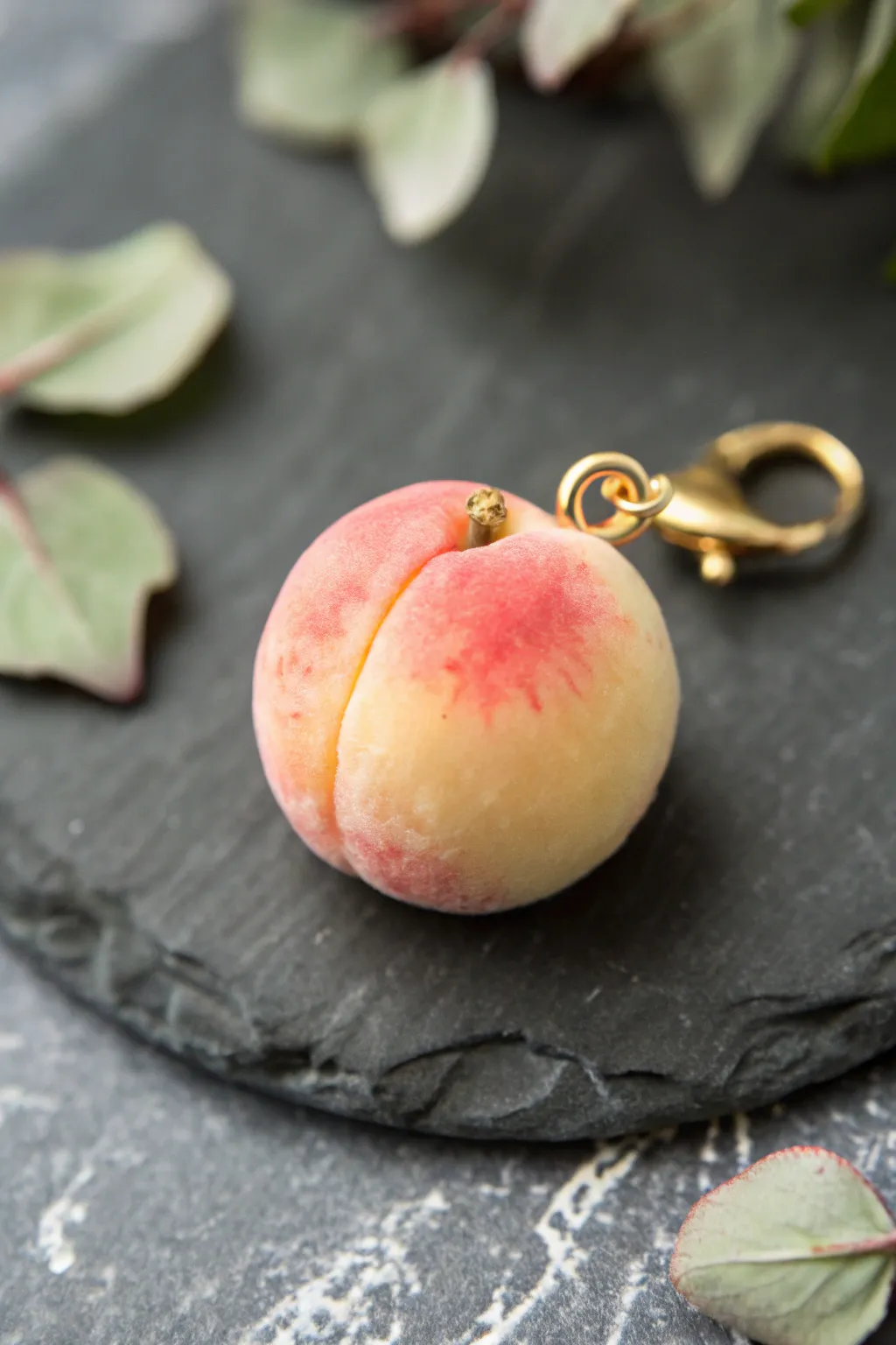 Peachy blush-gradient clay charm with a glossy skin finish, simple and sweet fruit-inspired decor.
