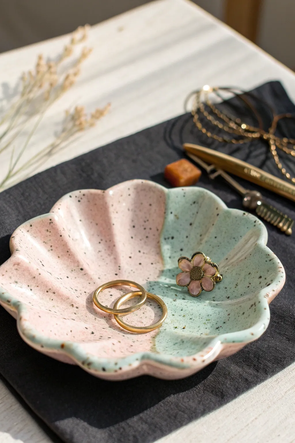 Scalloped flower-shaped clay trinket tray in pastel tones, perfect for rings and hair clips.