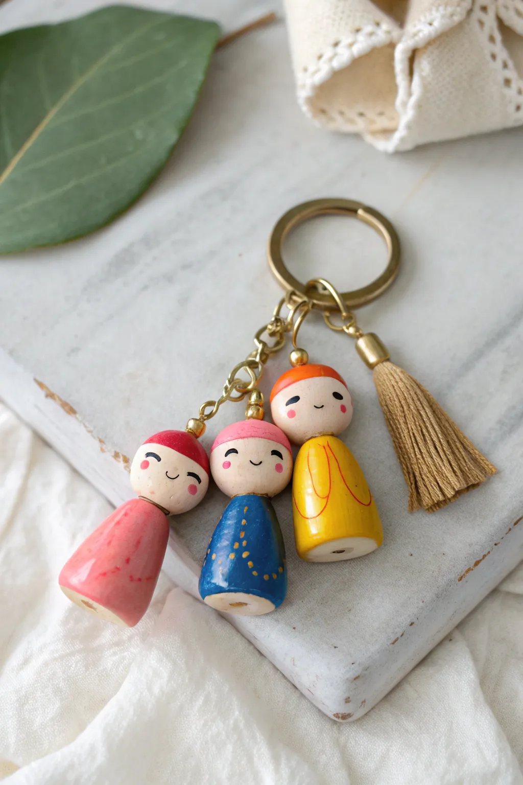 Tiny clay people keychain charms in bold colors, minimalist and boho, ready to gift.