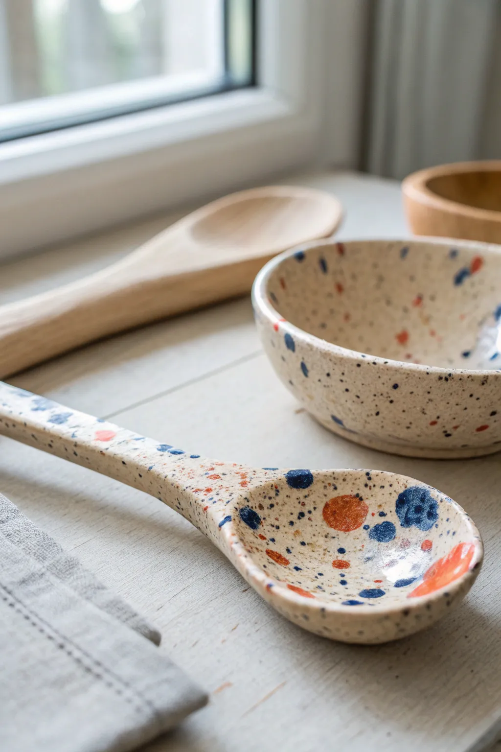 Speckled splatter-glaze clay spoon with bold color pops, simple and beautifully handmade.
