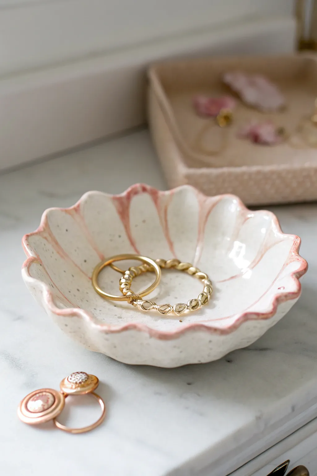 Creamy scalloped coquette catchall bowl, a sweet vanity spot for rings and pastel clips.