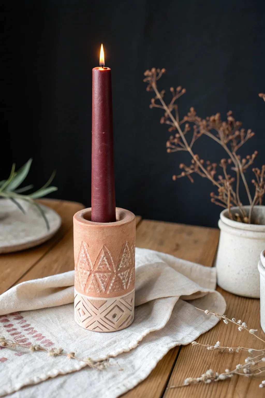 Handmade air dry clay candle holder with stamped patterns, cozy glow, minimal Scandi boho style.