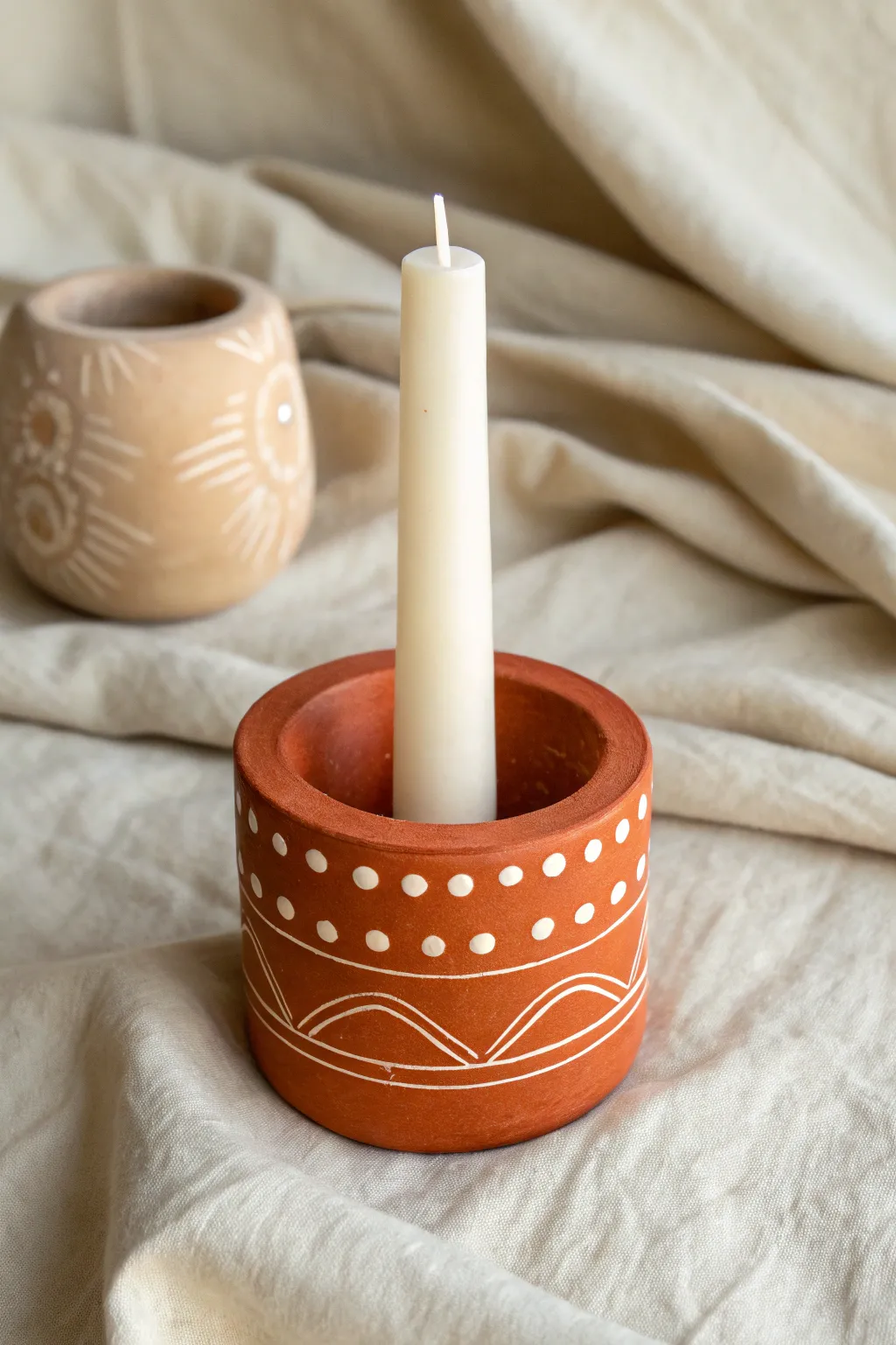 Cute DIY clay cylinder candle holder with simple cutouts, bold color, and clean minimalist charm
