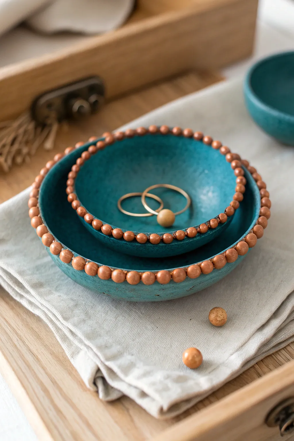 Chunky beaded mini dishes in bold teal and clay tones, perfect for rings or tea bags.