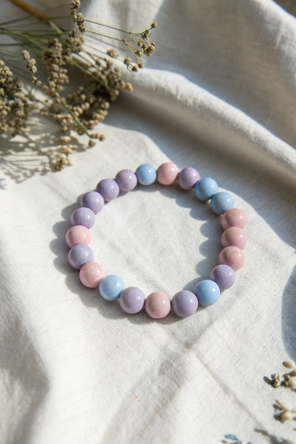 Marbled pastel clay bead bracelet in soft lavender, blue, and pink, minimalist and dreamy.
