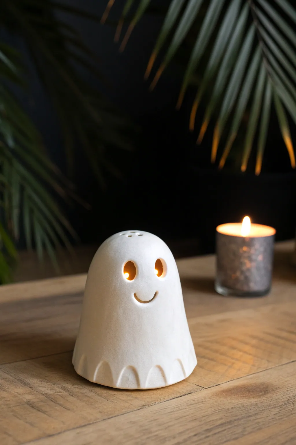 A friendly glowing clay ghost cover that turns a simple tealight into cozy Halloween magic