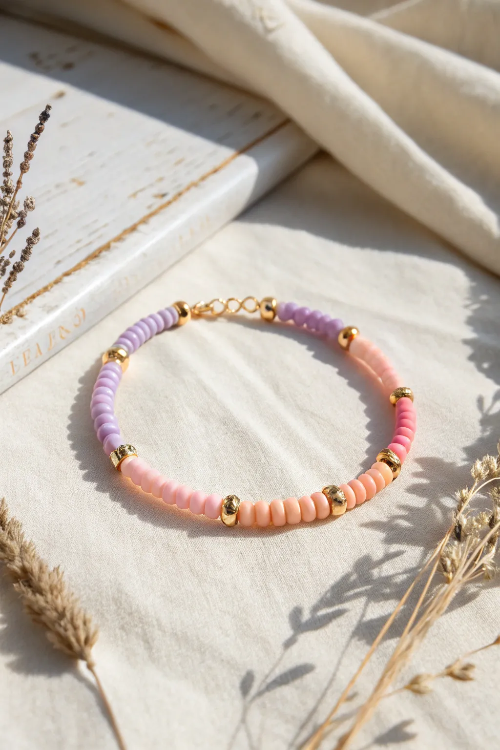 Pastel ombré heishi bracelet with tiny metallic spacers for a soft yet striking finish