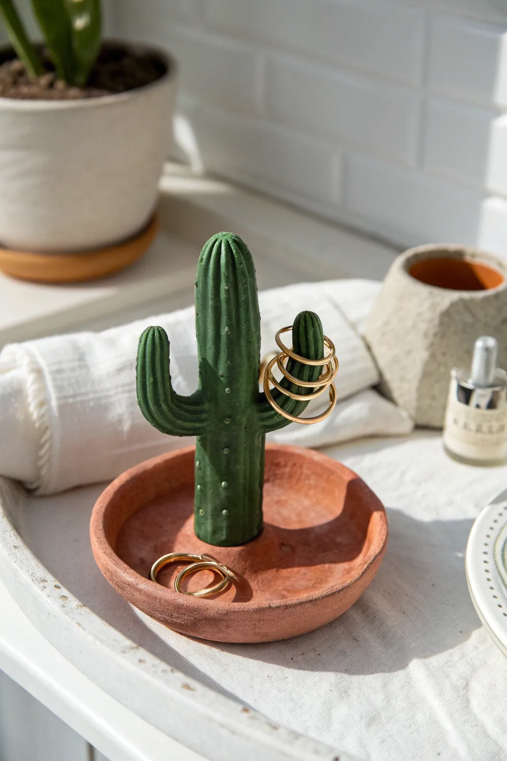 Minimal ring storage: mini cactus clay holder with bold glaze, perfect for everyday vanity.