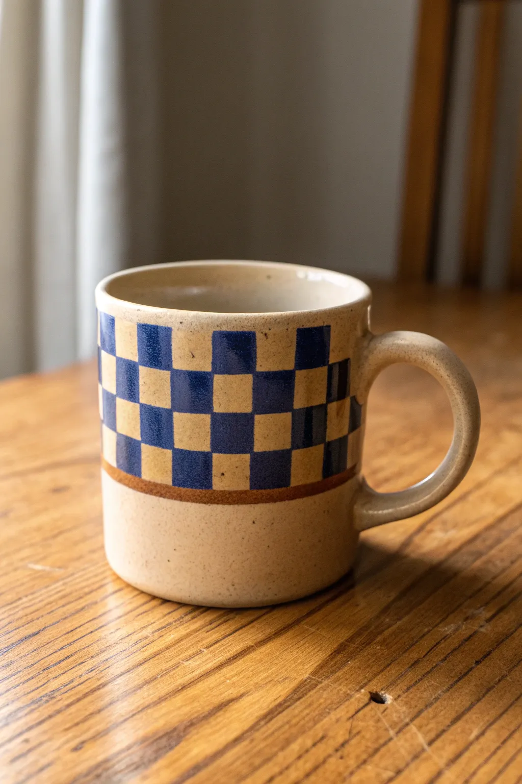 Bold two-tone checkerboard band gives this hand-painted mug an instant retro, cozy vibe.