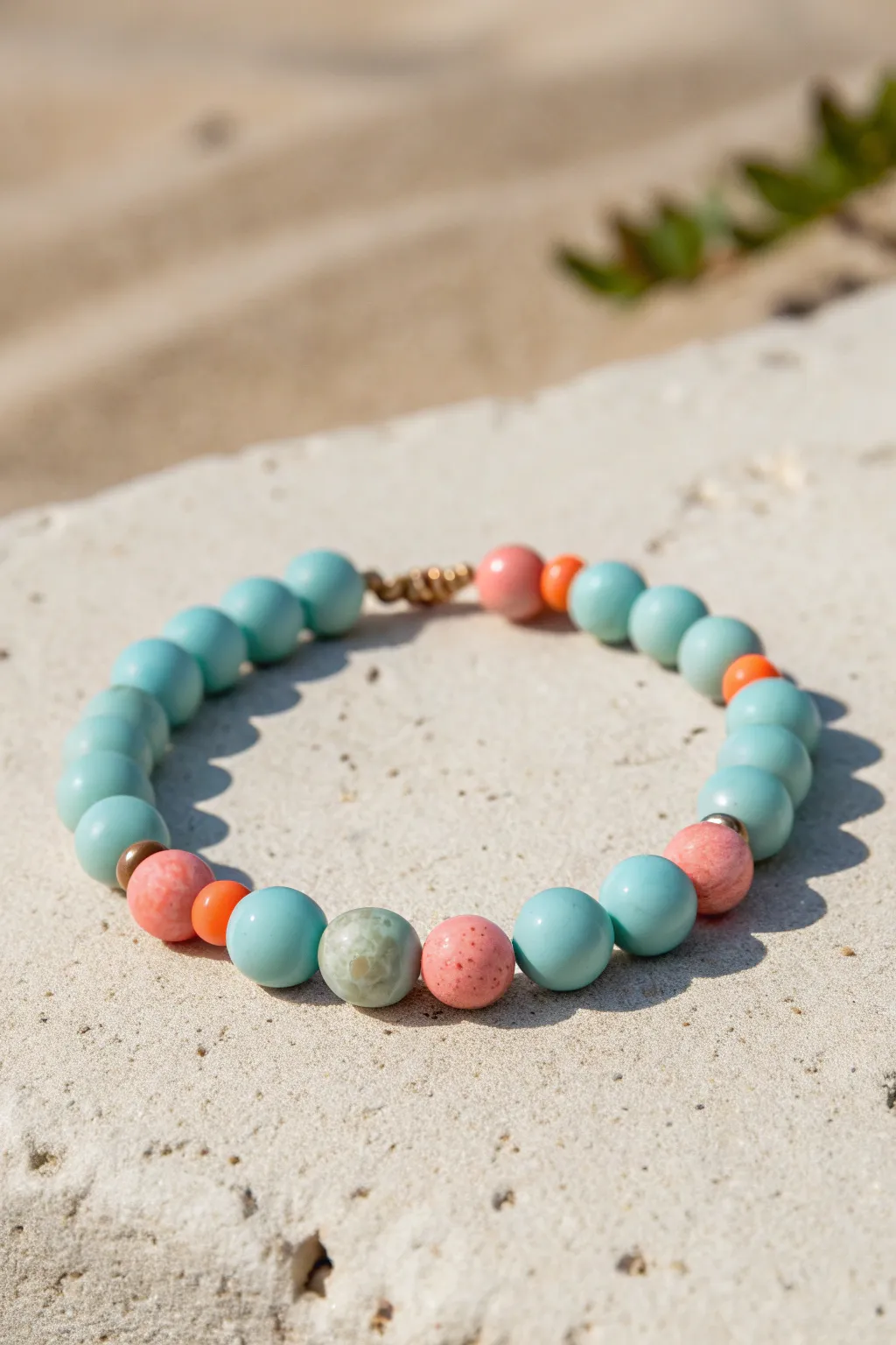 Aqua ocean clay beads with coral pops bring sunny reef vibes to a simple minimalist bracelet.