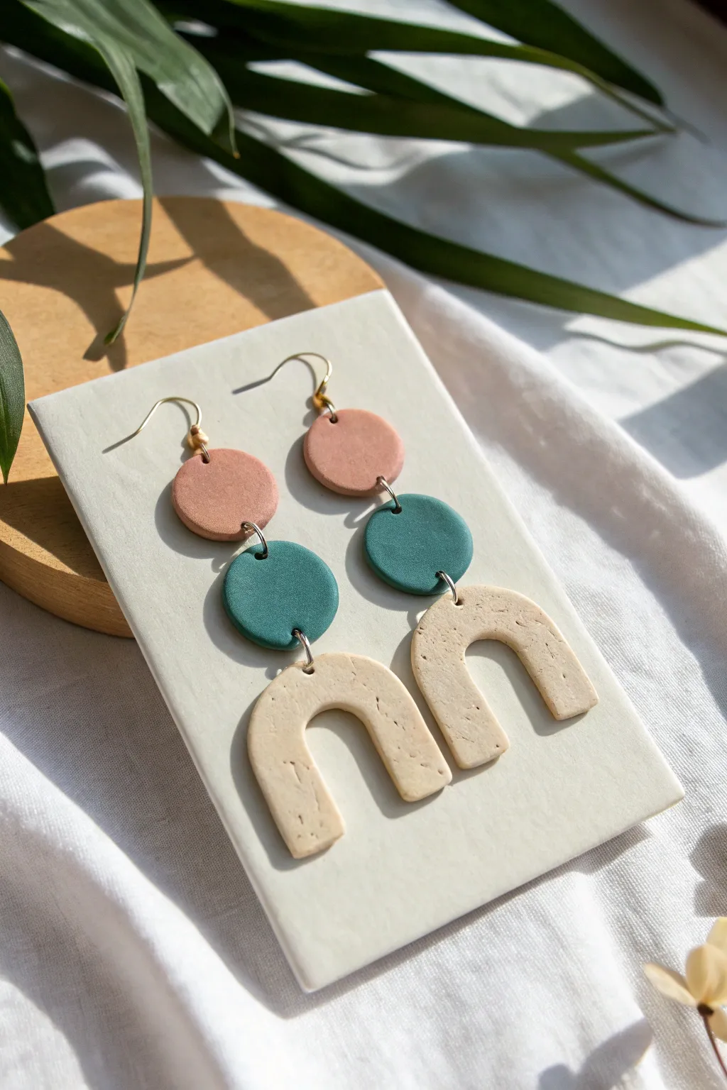 Lightweight paper clay statement earrings in modern arches and circles, minimalist boho vibes.
