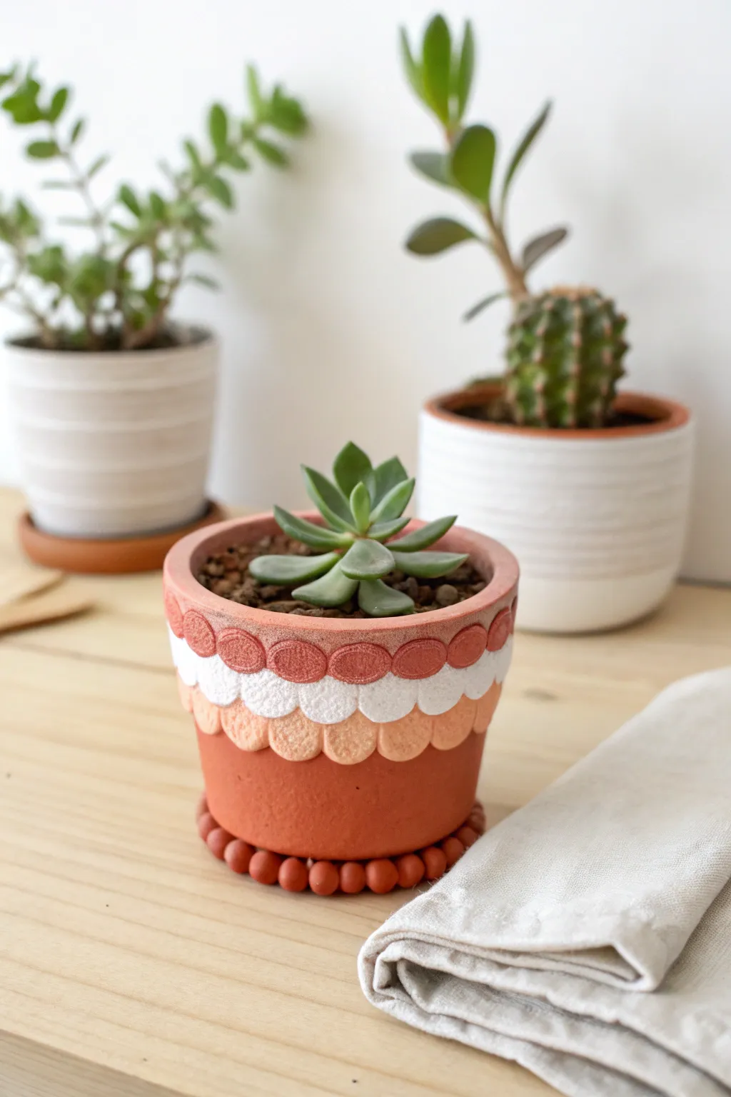 Petal-trim polymer clay mini planter with a tiny succulent, styled in a clean Scandi-boho nook.