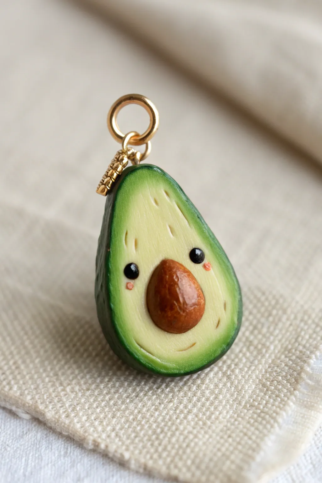 Sweet polymer clay avocado charm with a tiny smile, bold greens, and minimalist boho style